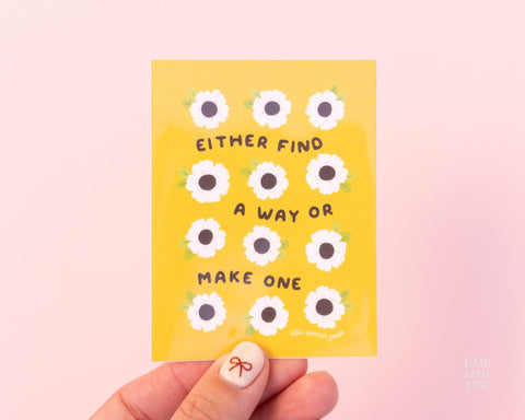 Cute yellow vinyl sticker illustrated with flowers and the text &quot;Either find a way or make one&quot;